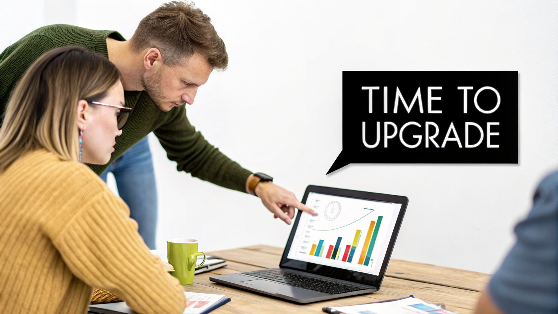 Two professionals discuss data on a laptop, with a 'Time to Upgrade' speech bubble.