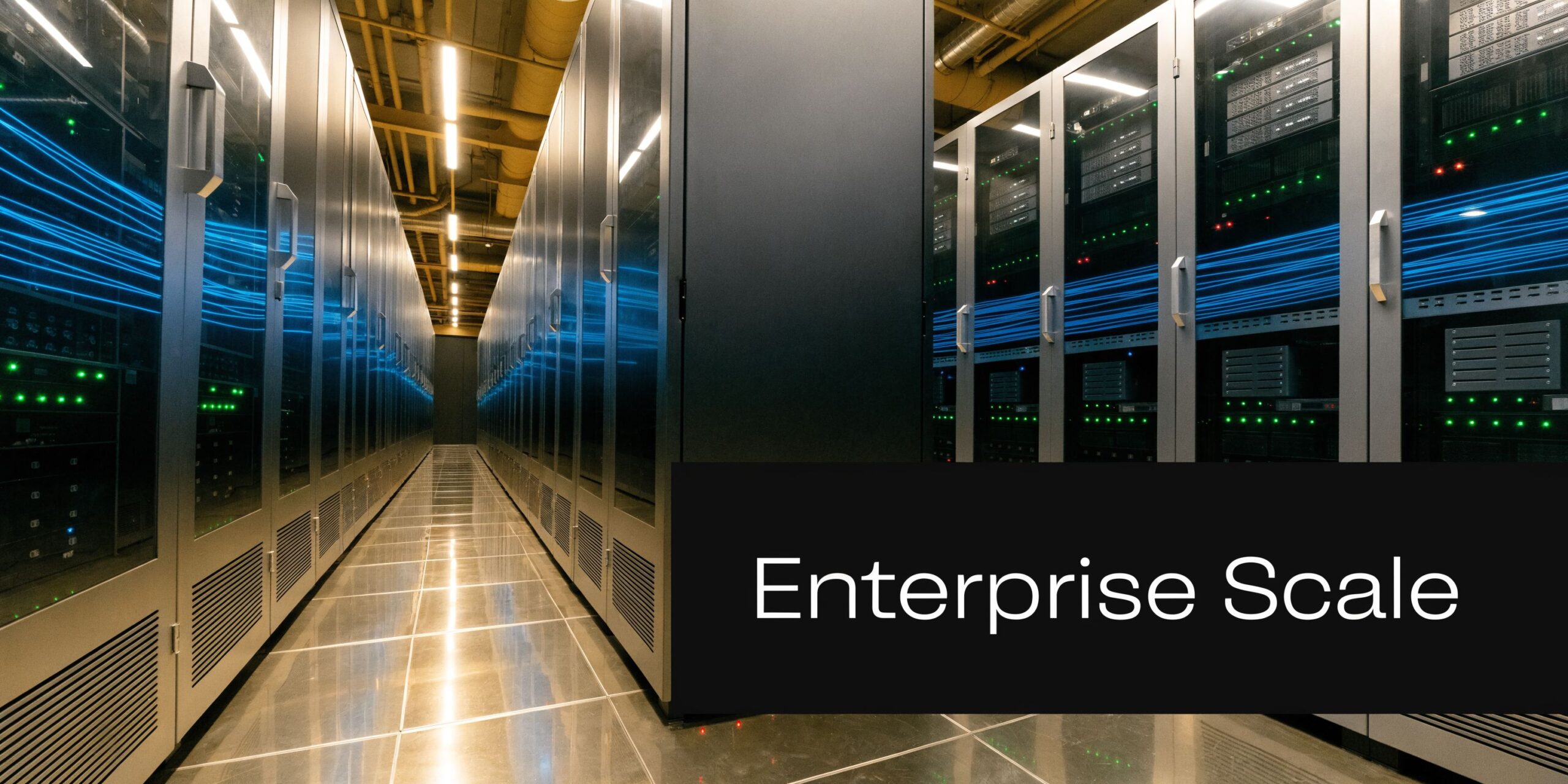 A modern server room with long rows of enterprise server racks under bright industrial lighting.